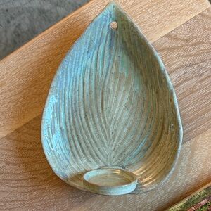 Hand crafted leaf pottery candle holder for wall.